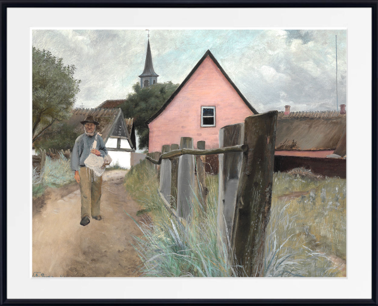 A framed art print featuring a landscape painting of a man walking along a dirt path towards a pink house and church steeple under a cloudy sky.