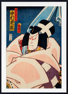 A framed Japanese ukiyo-e woodblock print showing a theatrical performer in costume against a blue background, with a white mat and black frame visible.