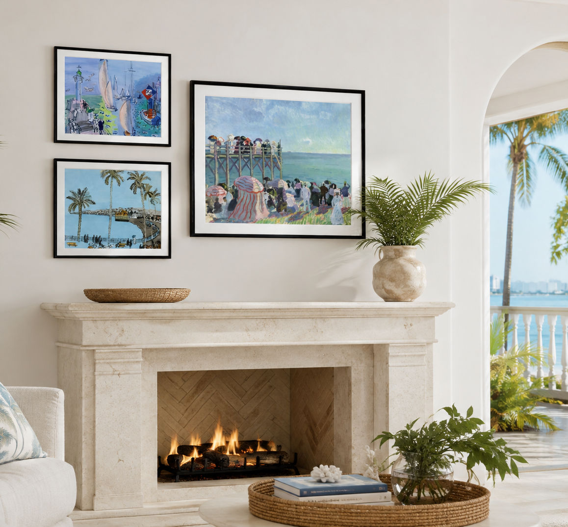 A styled interior scene showing three Raoul Dufy framed art prints displayed above a fireplace on a cream wall. The prints depict colorful beach and pier scenes, with a potted plant and decorative items on the mantel.