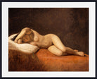 A framed classical painting depicting a reclining nude woman on a reddish-brown bed against a dark brown background, shown with a wide white mat and black frame.