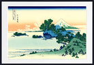 A framed Japanese-style landscape print showing a snow-capped mountain, water, trees, and a pale sky, with a white mat and black frame.