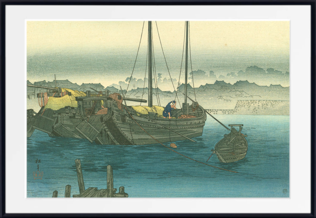 A framed Japanese-style art print depicting a harbor scene with traditional boats on blue water, a pale sky, and distant landforms. The print is shown with a white mat and a black frame.