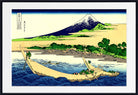 A framed Japanese-style art print depicting a snowy mountain, shoreline, boats, and blue waves, shown against a white mat and black frame.