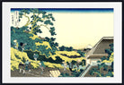 A framed Japanese-style art print depicting a scenic landscape with trees, figures, a house, and distant mountains, shown against a white mat and black frame.