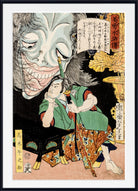 A framed Japanese ukiyo-e woodblock print showing a seated figure in a green robe and patterned skirt facing a large grotesque face with an open mouth, with Japanese text panels and a black frame around the artwork.