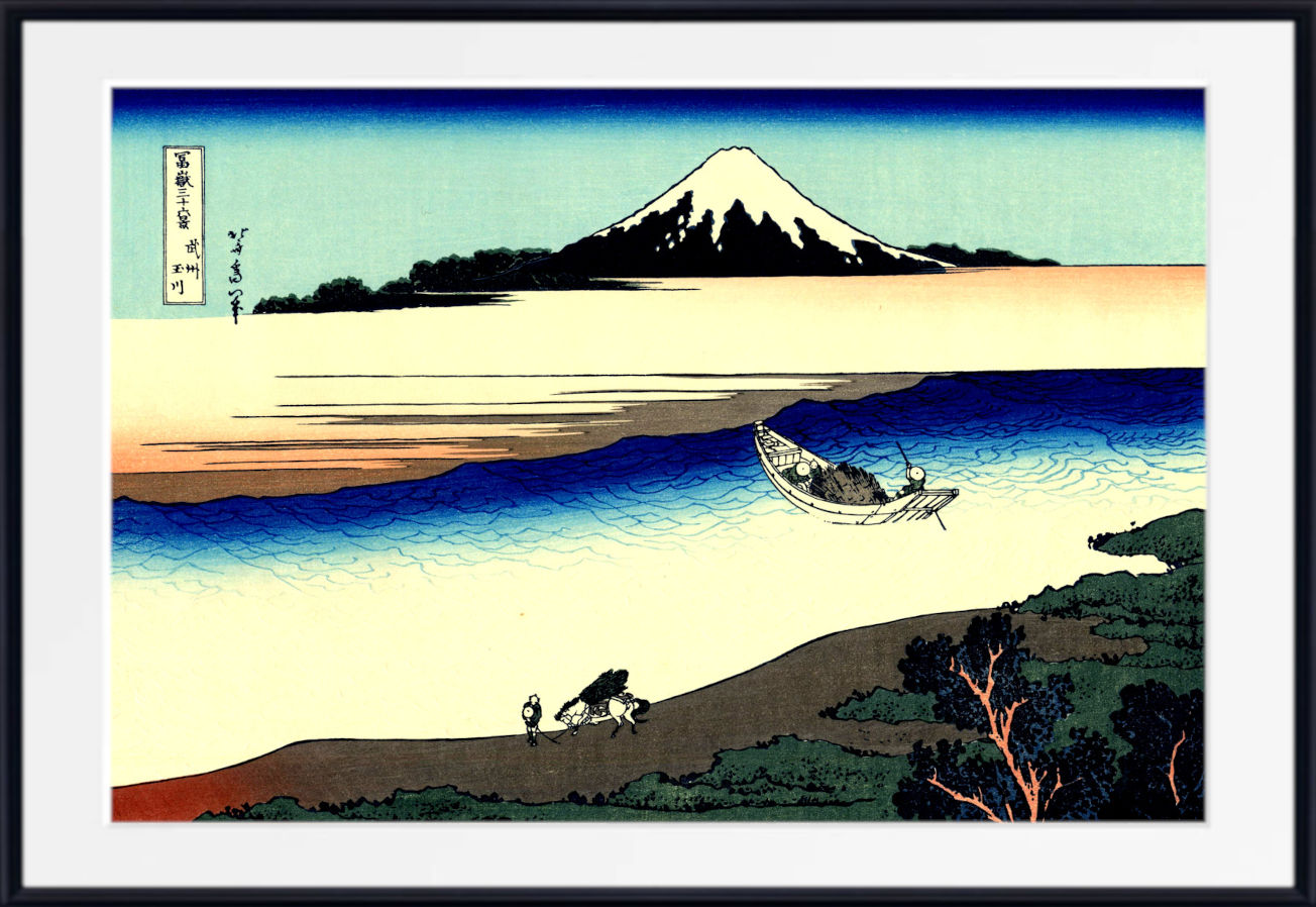 A framed Japanese-style art print depicting a snowy mountain, blue water, a small boat, and figures on a shoreline, shown against a white mat and black frame.