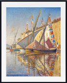 A framed impressionist-style painting of sailboats on water with a pale blue sky and warm beige buildings, shown with a white mat and black frame.