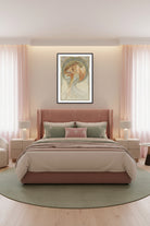 An Art Nouveau style art print featuring a woman in flowing white drapery with long orange-brown hair, framed by a decorative arch in blue, gold, and beige tones. The print is shown with a white mat and a black frame against a light background.