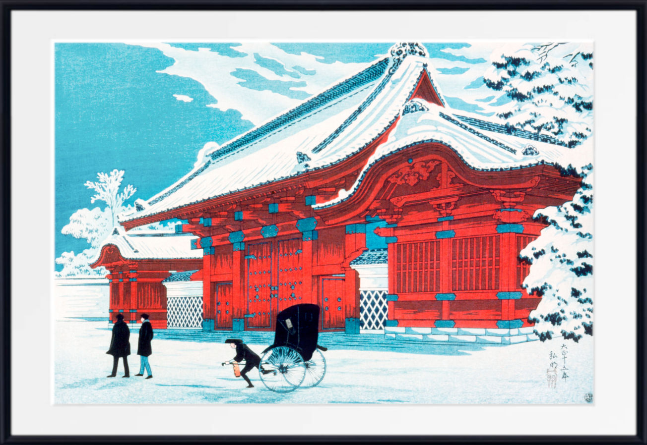 A framed art print depicting a traditional Japanese red temple in a snowy landscape under a light blue sky, with a black rickshaw and two walking figures in the foreground.