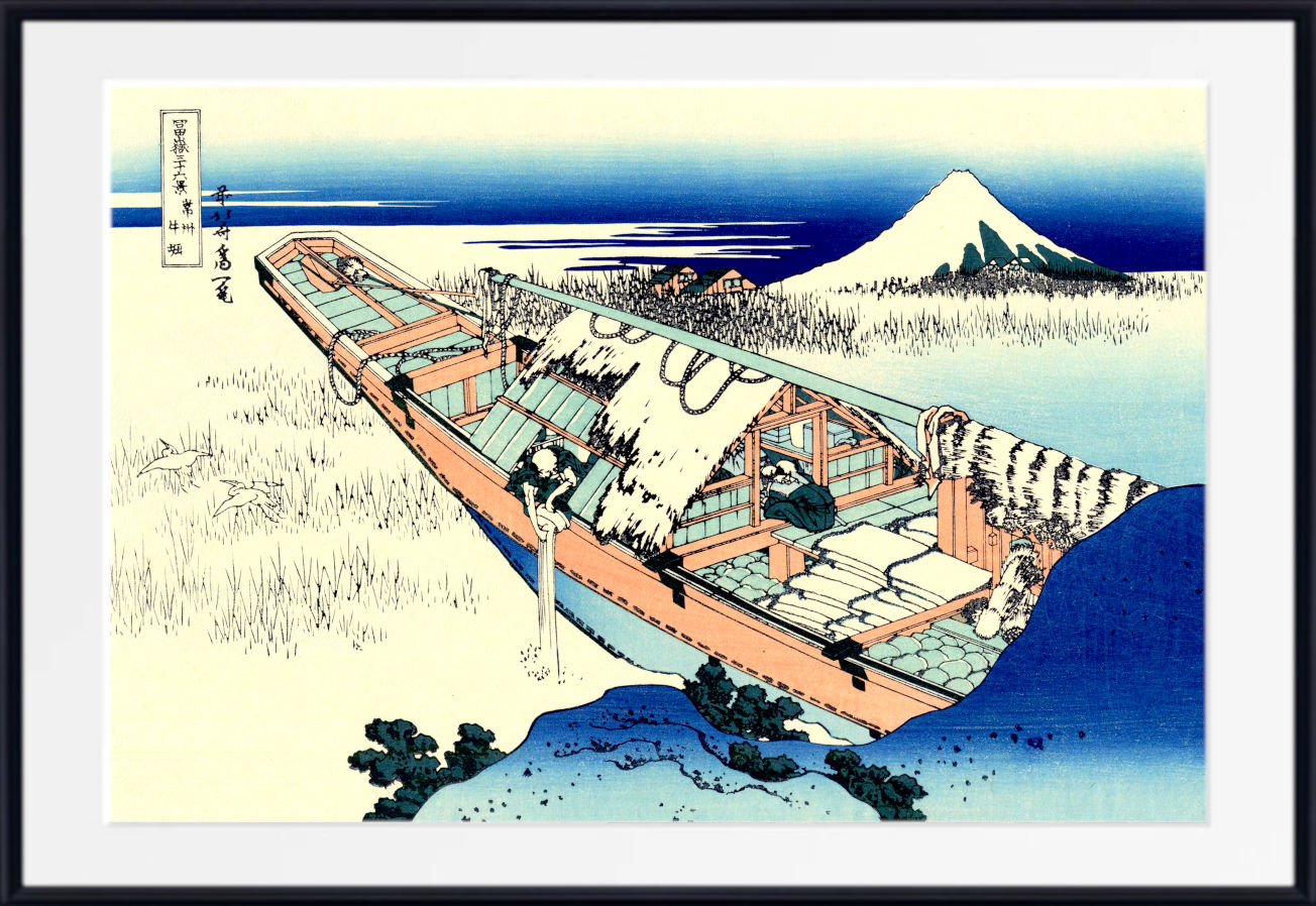 A framed Japanese-style art print depicting a snow-covered boat on a shoreline with Mount Fuji in the background, shown against a white mat and black frame.