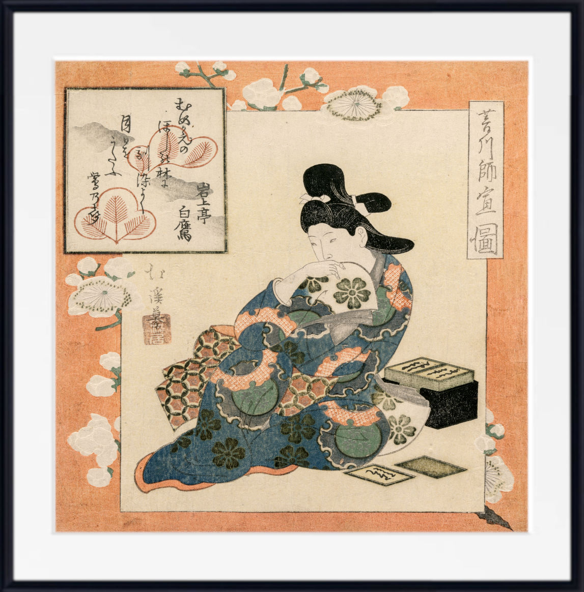 A framed Japanese ukiyo-e woodblock print showing a seated woman in a blue floral robe holding a fan, with cherry blossoms and calligraphic panels around her, presented against a white background with a black frame.