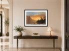 Albert Bierstadt Print, Sunset in California displayed above a console table
