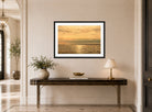 Amaldus Nielsen Print, Solspeil, Hvaler (1890) displayed above a console table