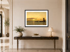 Amaldus Nielsen Print, Ved solnedgang (1916) displayed above a console table