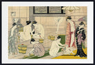 A framed Japanese ukiyo-e woodblock print depicting several women in a bathhouse, with one nude woman standing near a tub and others in patterned kimonos. The print is shown with a wide white mat and a black frame against a light gray background.