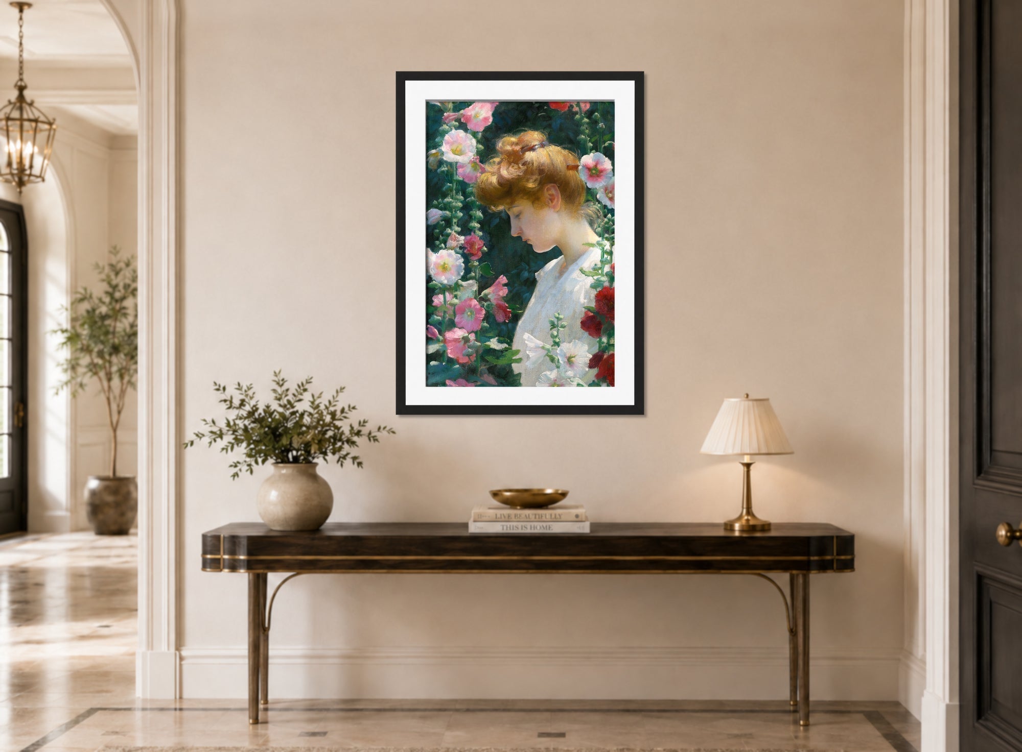 Charles Courtney Curran Print, Hollyhocks and Sunlight (1902) displayed above a console table