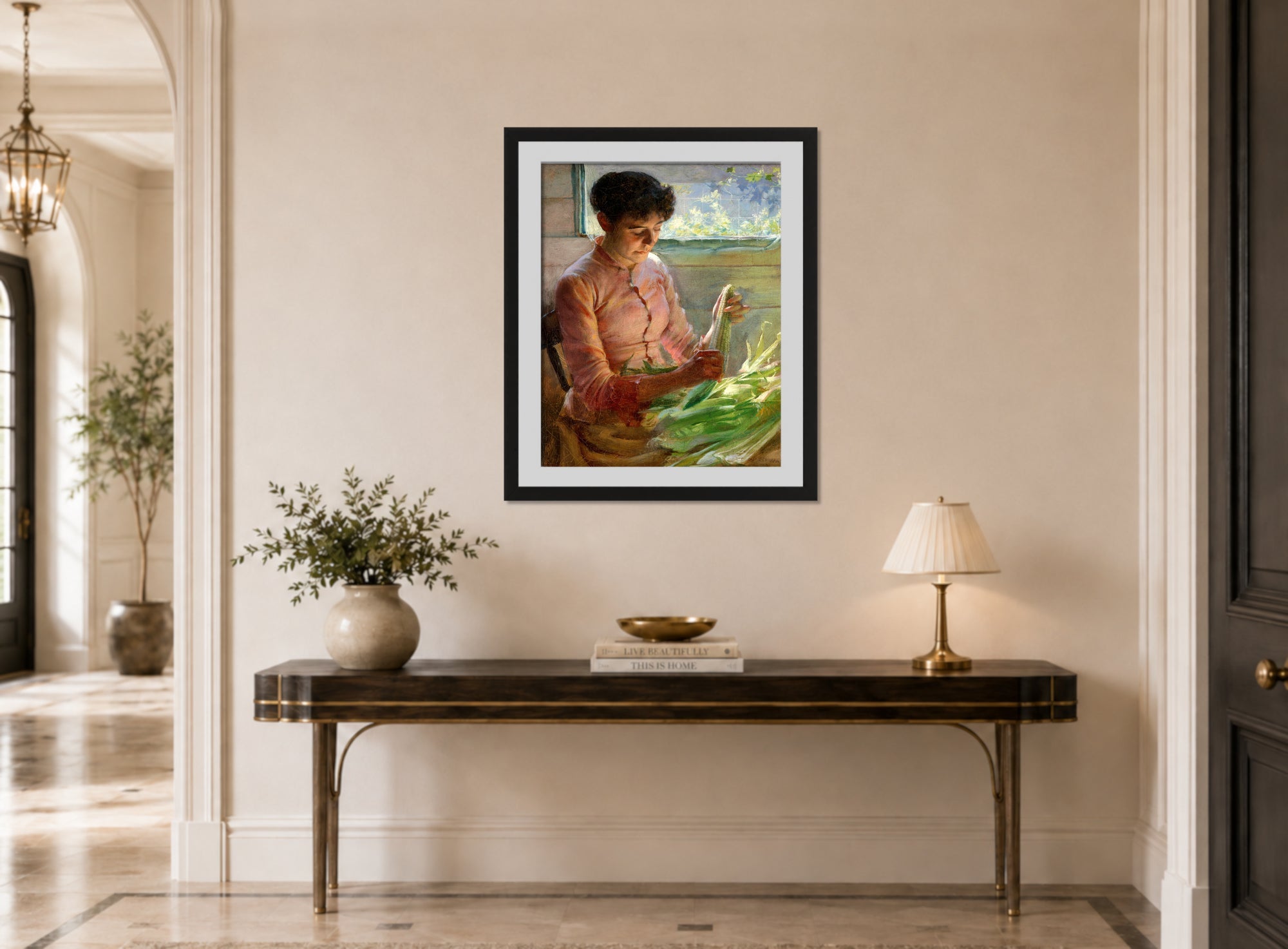 Charles Courtney Curran Print, Shucking Corn (1891) displayed above a console table