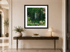 Charles Courtney Curran Print, The Edge of the Woods (1912) displayed above a console table