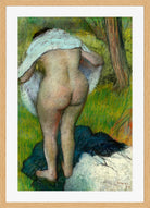 Edgar Degas Print, Young Woman Dressing Herself (1885) in a light oak frame