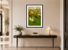 Harold Harvey Print, Springtime In The Orchard displayed above a console table
