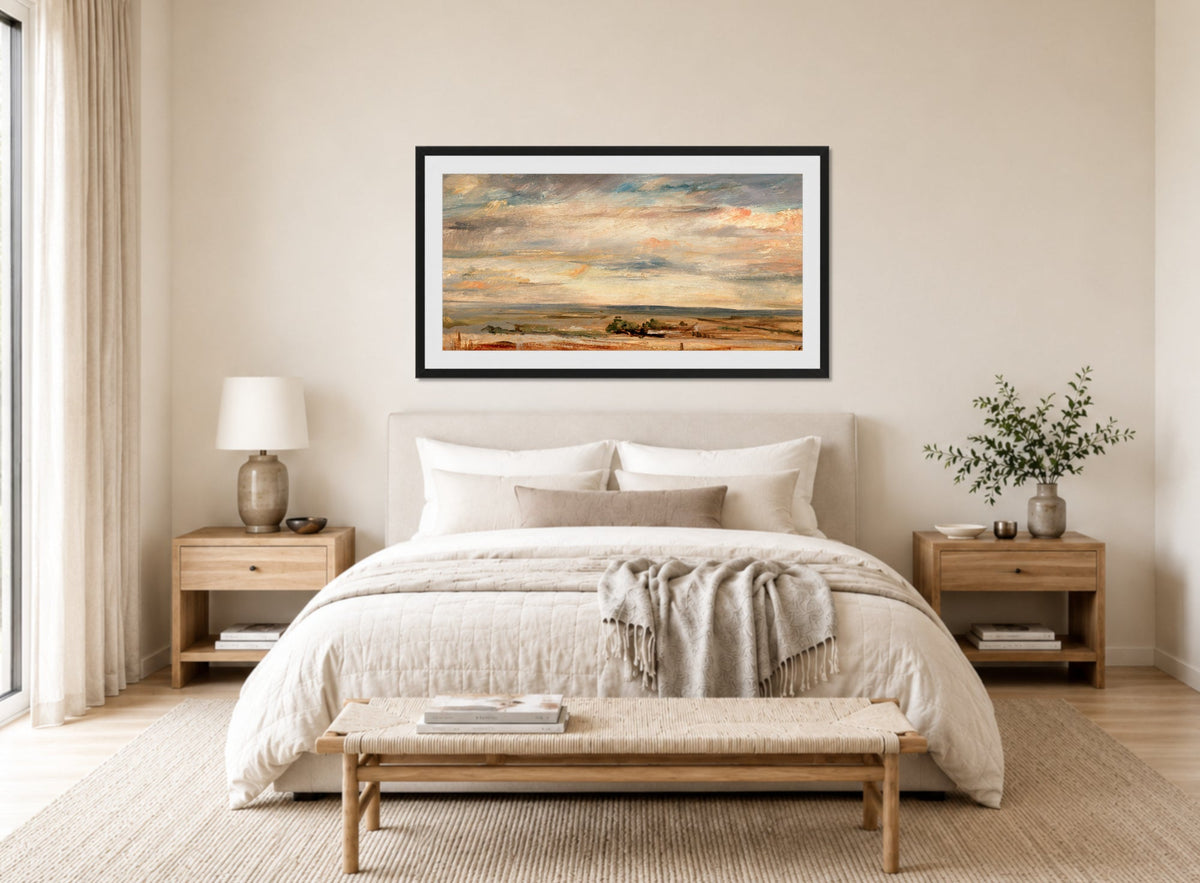 John Constable Print, Cloud Study, Early Morning, Looking East from Hampstead (1821) displayed above a bed