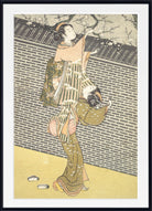 A framed Japanese-style art print depicting a woman in a kimono holding a basket, with cherry blossoms and a brick wall in the background.