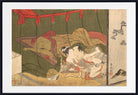 A framed Japanese ukiyo-e woodblock print depicting an intimate scene between two figures, with a white mat border and black frame around it.