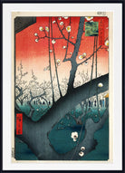 A framed Japanese ukiyo-e woodblock print featuring a large dark tree branch with white blossoms against a red-to-teal gradient sky, shown with a white mat and black frame.