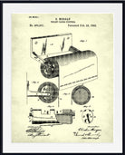 A framed vintage patent print of E. Morgan's toilet paper feeder, dated February 23, 1992, featuring black technical line drawings on an aged cream paper background, enclosed in a black frame.