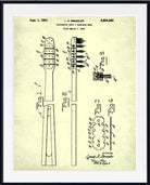 A framed vintage patent print of a toothbrush head design by L. R.