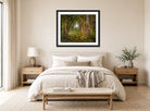William Trost Richards Print, In the Woods (1860) displayed above a bed
